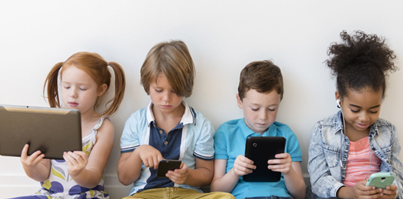 Kids looking at electronic devices